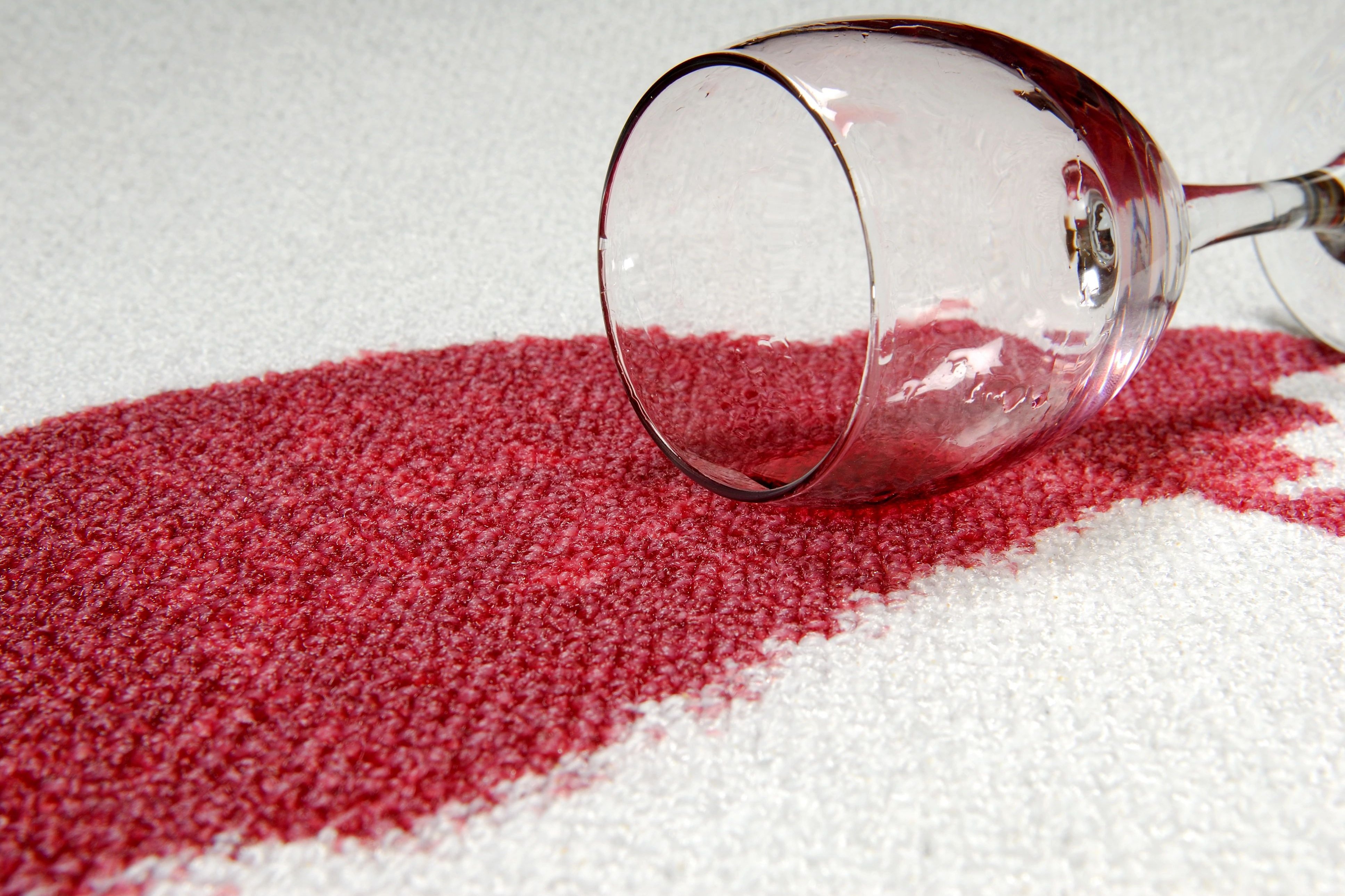 Red wine spilled on white carpet from Matson Rugs, Inc in Berlin, CT