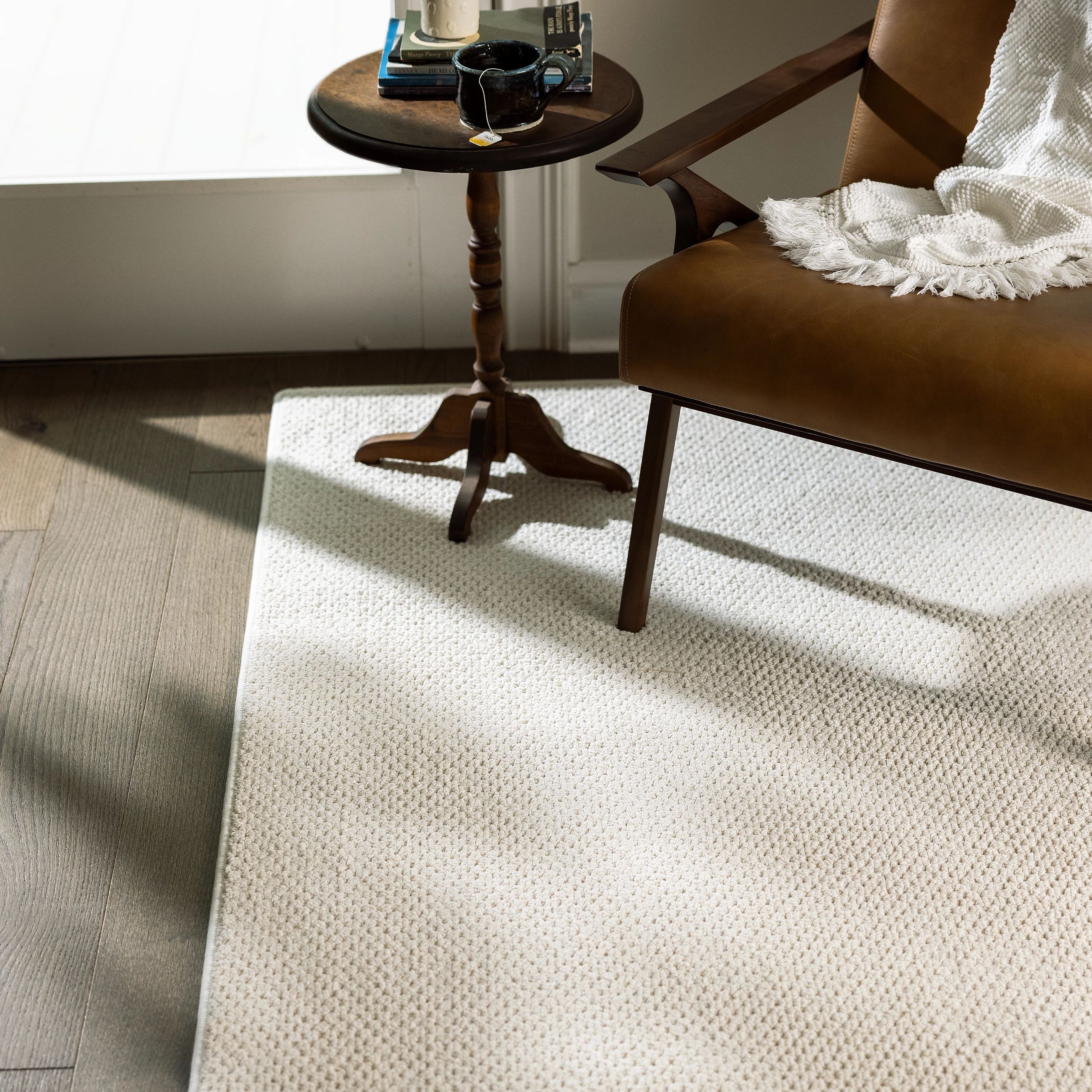 White rug on hardwood flooring - Carpet binding services from Matson Rugs, Inc in Berlin, CT